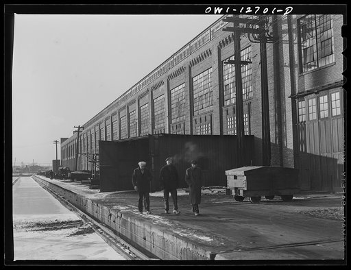 Untitled photo, possibly related to: Workmen coming out of locomotive shops at the end of the shift at 40th Street shops, Chicago and Northwestern Railroad