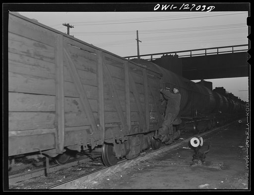 Untitled photo, possibly related to: Chicago, Illinois. Switchmen making up a train at a Chicago and Northwestern Railroad