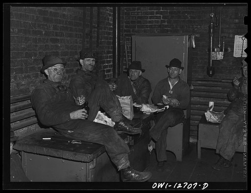 Chicago, Illinois. Workmen at the Chicago and Northwestern Railroad's locomotive shops during their half-hour lunch period