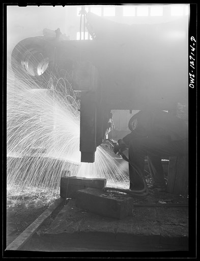Untitled photo, possibly related to: Chicago, Illinois. A welder who works in the roundhouse at the Chicago and Northwestern Railroad's Proviso yard