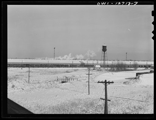 Chicago, Illinois. View of a Chicago and Northwestern Railroad freight house. A long line of truck trailers are loading and unloading goods