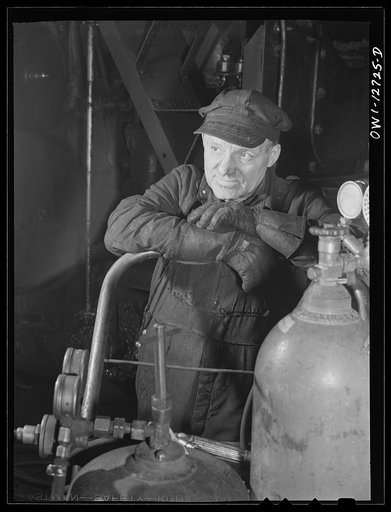 Chicago, Illinois. A welder who works at a Chicago and Northwestern Railroad roundhouse