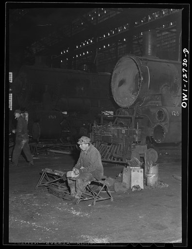 Chicago, Illinois. Workman having lunch at the Chicago and Northwestern Railroad locomotive repair shops