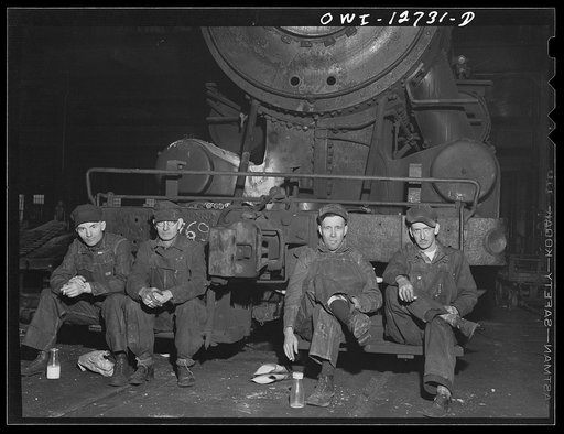 Untitled photo, possibly related to: Chicago, Illinois. Workman having lunch at the Chicago and Northwestern Railroad locomotive repair shops