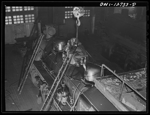 Chicago, Illinois. Working on a locomotive at the Chicago and Northwestern Railroad locomotive repair shops