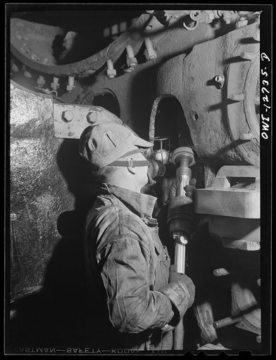 Chicago, Illinois. Grinding down a part of locomotive cylinder housing at the Chicago and Northwestern Railroad shops
