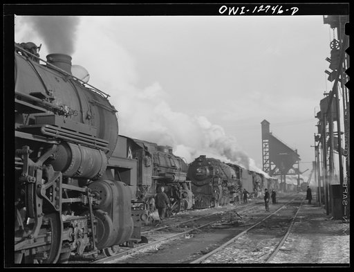 Untitled photo, possibly related to: Chicago, Illinois. Locomotives over the ash pit at the roundhouse and coaling station at the Chicago and Northwestern Railroad yards