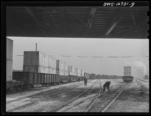 Chicago, Illinois. Gondola cars loaded with war equipment in one of the Chicago and Northwestern classification yards