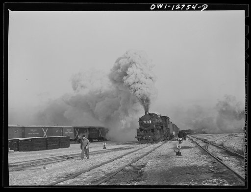 Chicago, Illinois. Train pulling out of one of the classification yards at a Chicago and Northwestern Railroad