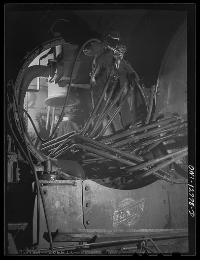 Chicago, Illinois. Working on piping of the boiler of a locomotive at the Chicago and Northwestern Railroad repair shops