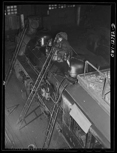 Chicago, Illinois. Working on a locomotive at the Chicago and Northwestern Railroad repair shops