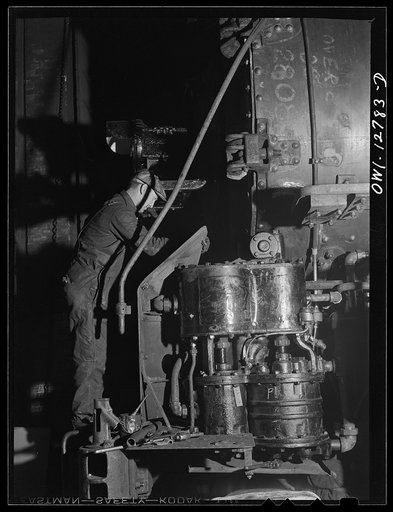 Chicago, Illinois. Working on a locomotive at the Chicago and Northwestern Railroad repair shops