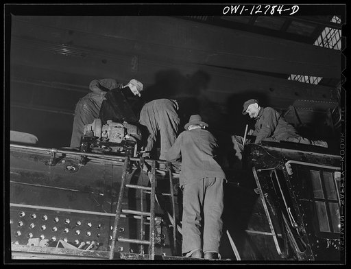 Chicago, Illinois. Working on a locomotive at the Chicago and Northwestern repair shops