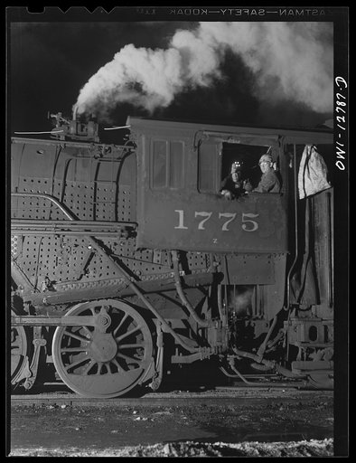 Untitled photo, possibly related to: Chicago, Illinois. Working on a locomotive at the Chicago and Northwestern repair shops