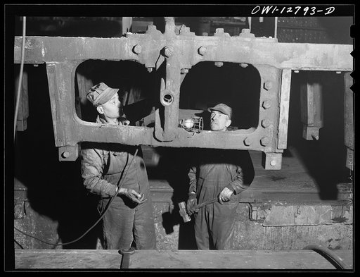 Chicago, Illinois. Working on the frame of a locomotive at the Chicago and Northwestern Railroad repair shops