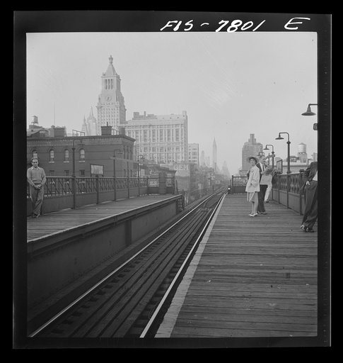 Untitled photo, possibly related to: New York, New York. Looking north from the Ninth Street station on the Third Avenue elevated railway as a train leaves on the local track