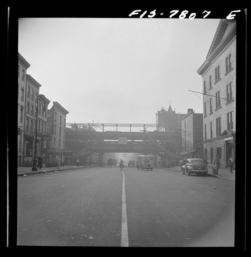 New York, New York. Second Avenue elevated railway at 14th Street, in process of demolition; looking east at 7 a.m.