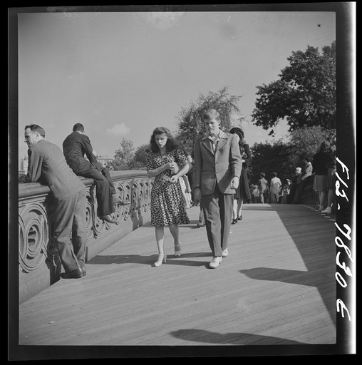 New York, New York. Bridge over Central Park lake, Sunday