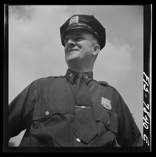 New York, New York. Irish-American policeman in Central Park on Sunday