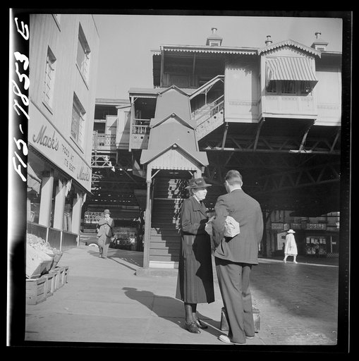 New York, New York. 94th Street station of the Third Avenue elevated railway at 8 a.m.