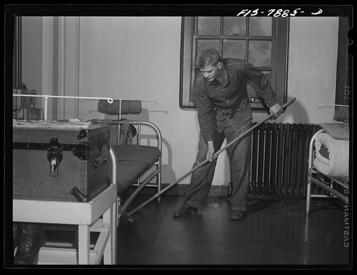 Fort Belvoir, Virginia. Sergeant George Camblair on fatigue duty in his barracks