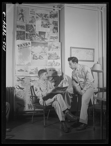 Fort Belvoir, Virginia. Sergeant George Camblair waiting for mess call in the recreation room at camp