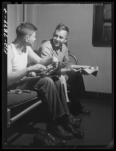 Fort Belvoir, Virginia. A regular part of Sergeant George Camblair's chores is shoe shining