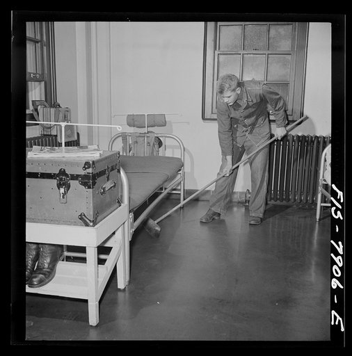 Fort Belvoir, Virginia. Sergeant George Camblair on fatigue duty in his barracks