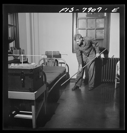 Untitled photo, possibly related to: Fort Belvoir, Virginia. Sergeant George Camblair on fatigue duty in his barracks