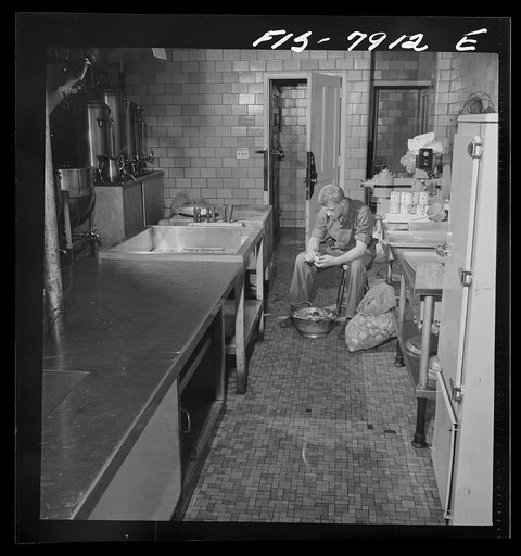 Fort Belvoir, Virginia. Sergeant George Camblair on kitchen police duty