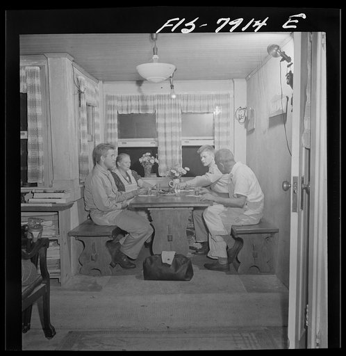 Untitled photo, possibly related to: Washington, D.C. Sergeant George Camblair while on a visit home finds that his younger brother is at home also, on a furlough from the army