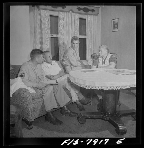 Untitled photo, possibly related to: Washington, D.C> Sergeant George Camblair while on a visit home finds that his younger brother is at home also on a furlough from the army