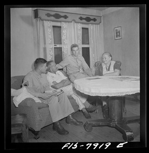 Untitled photo, possibly related to: Washington, D.C> Sergeant George Camblair while on a visit home finds that his younger brother is at home also on a furlough from the army