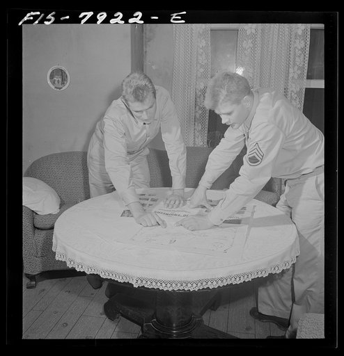 Untitled photo, possibly related to: Washington, D.C. Sergeant George Camblair while on a visit home finds that his younger brother is at home also on a furlough from the Army