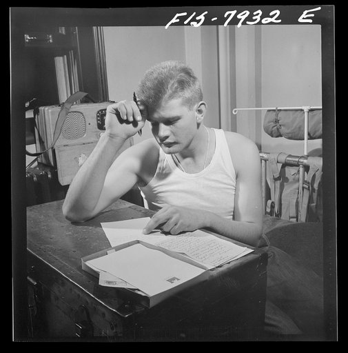 Fort Belvoir, Virginia. Sergeant George Camblair writing letters home from camp
