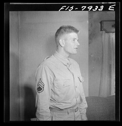 Untitled photo, possibly related to: Washington, D.C. Sergeant George Camblair while on a visit home finds that his younger brother is at home also on a furlough from the Army