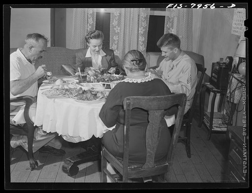 Washington, D.C. Sergeant George Camblair and his girlfriend having dinner with his family while he is at home on a weekend furlough