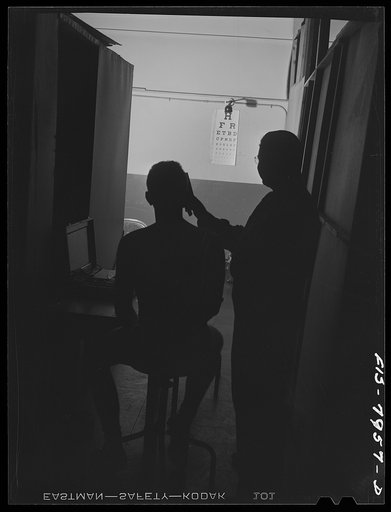 Untitled photo, possibly related to: Baltimore, Maryland. George Camblair's eyes being examined at the induction station