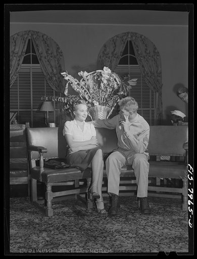 Untitled photo, possibly related to: Washington, D.C. Sergeant George Camblair and his girl sitting out a number at a United Service Organization USO) dance while he is at home on a weekend furlough
