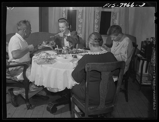 Washington, D.C. Sergeant George Camblair and his girlfriend having dinner with his family while he is at home on a weekend furlough
