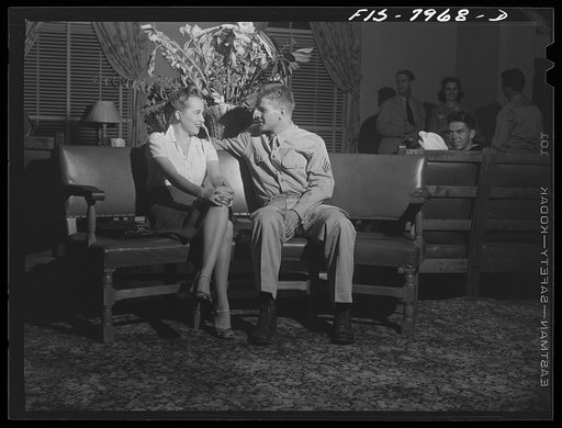 Washington, D.C. Sergeant George Camblair and his girl sitting out a number at a United Service Organization USO) dance while he is at home on a weekend furlough