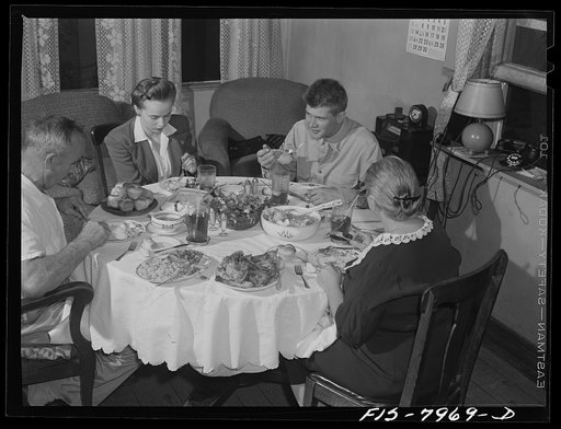Untitled photo, possibly related to: Washington, D.C> Sergeant George Camblair and his girlfriend having dinner with his family while he is at home on a weekend furlough