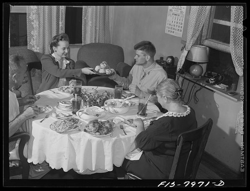 Untitled photo, possibly related to: Washington, D.C> Sergeant George Camblair and his girlfriend having dinner with his family while he is at home on a weekend furlough