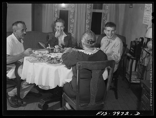 Untitled photo, possibly related to: Washington, D.C> Sergeant George Camblair and his girlfriend having dinner with his family while he is at home on a weekend furlough
