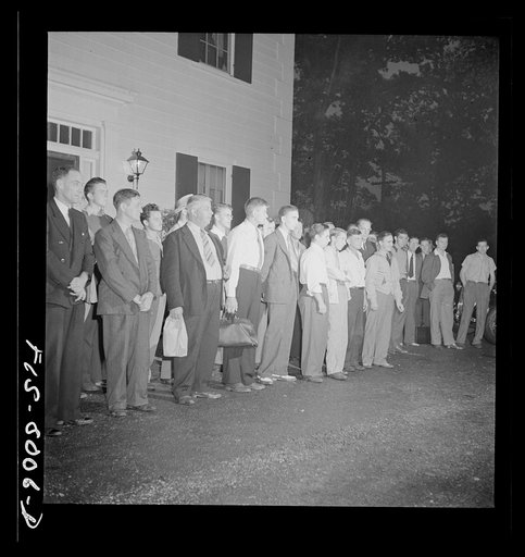 Washington, D.C. George Camblair lining up at the Selective Board early in the morning with other young men who are leaving with him for the induction station