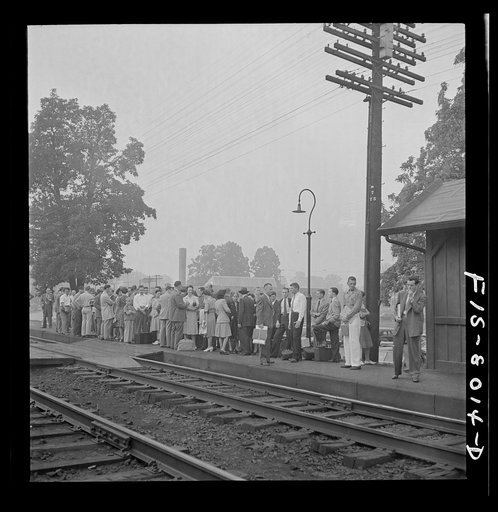 Untitled photo, possibly related to: Silver Spring, Maryland. George Camblair waiting at the station for the train which will take him to the induction center
