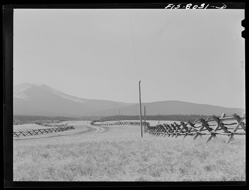 Big Hole Valley, Beaverhead County, Montana. Fences and road leaving Wisdom, Montana