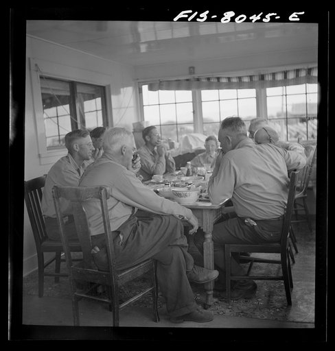 Untitled photo, possibly related to: Big Hole Valley, Beaverhead County, Montana. Ranchers and cattle buyers eating dinner at ranch. Buyers from the middle west come out to the ranches in the fall to select feeder cattle