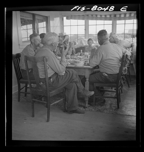 Untitled photo, possibly related to: Big Hole Valley, Beaverhead County, Montana. Ranchers and cattle buyers eating dinner at ranch. Buyers from the middle west come out to the ranches in the fall to select feeder cattle
