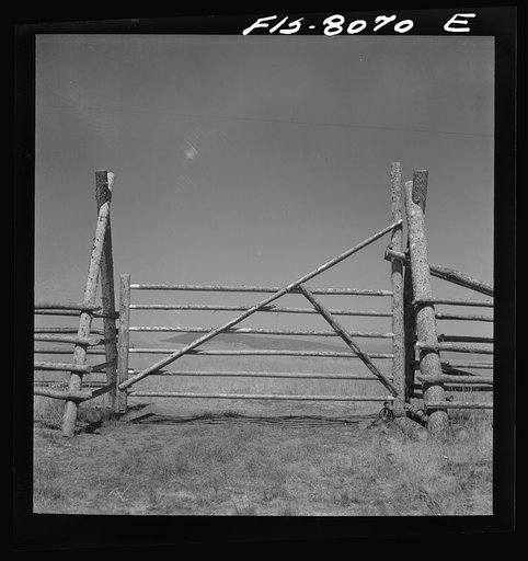 Big Hole Valley, Beaverhead County, Montana. Fence and gate on cattle ranch
